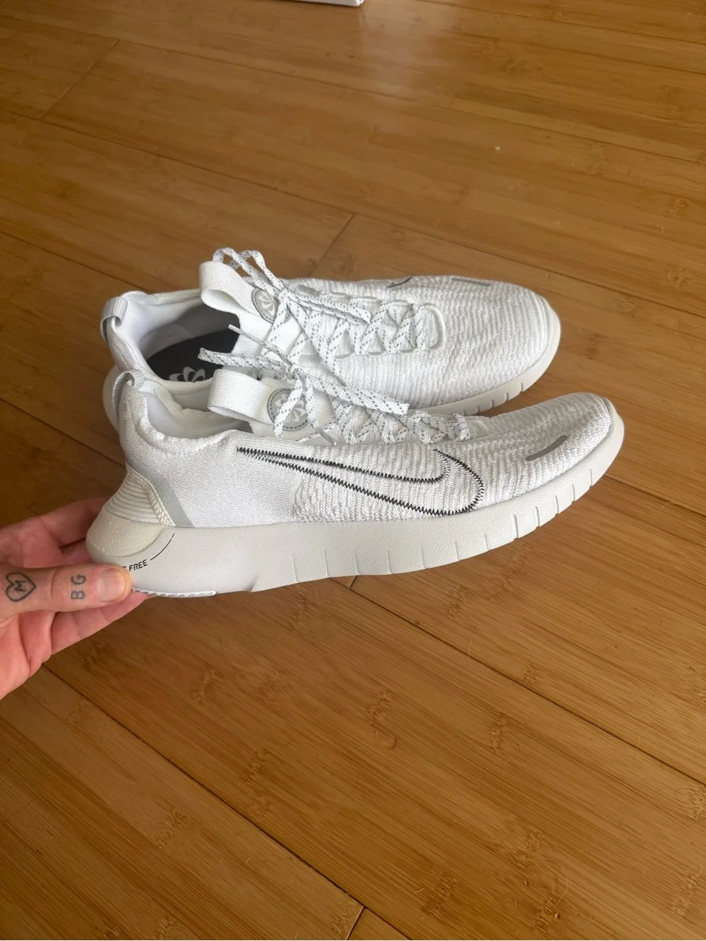 Nike Men’s White and Black Swoosh Free RN Lightweight Sneakers